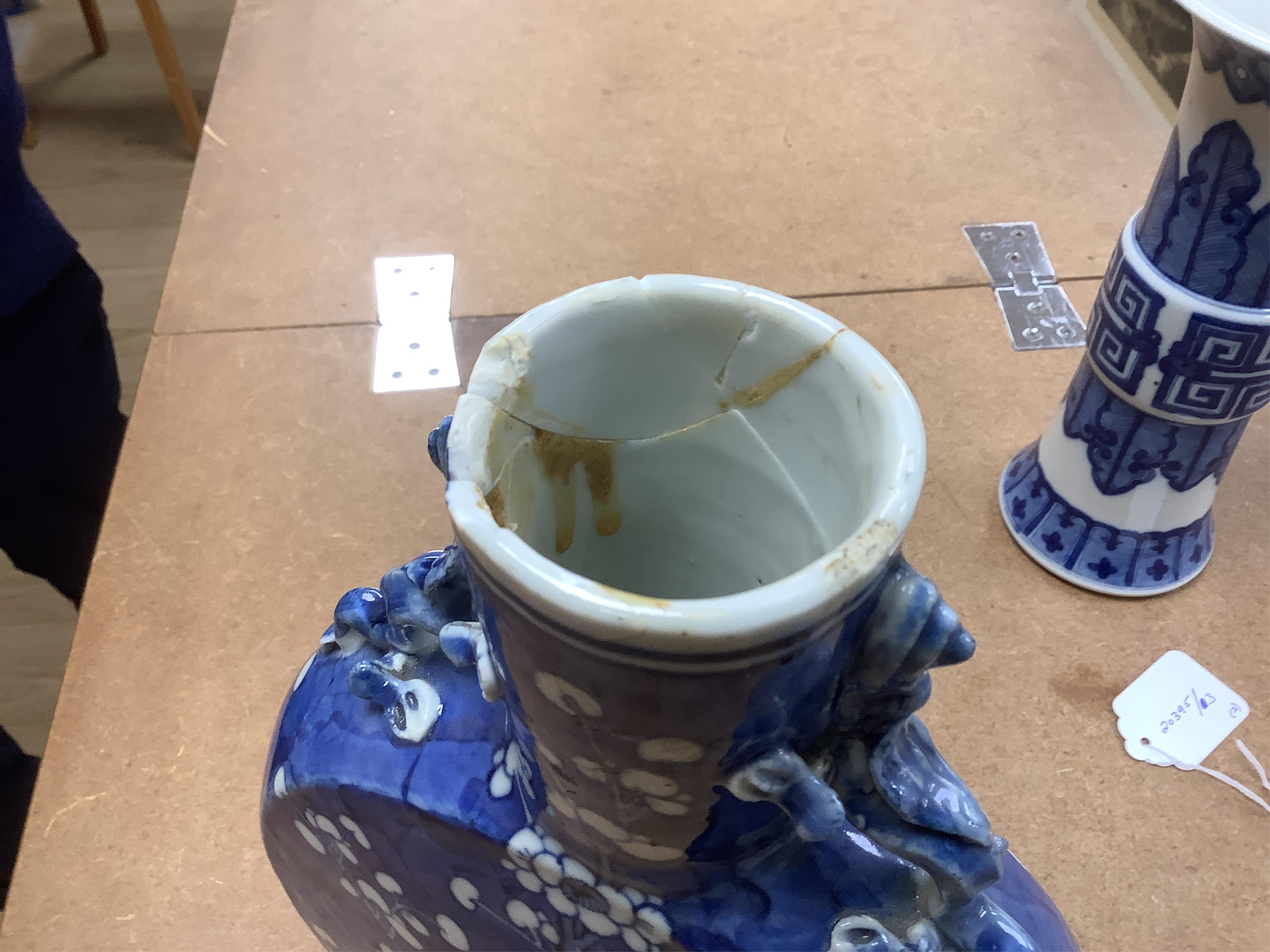 A Chinese blue and white prunus flower moon-flask and a Gu vase, largest 30cm high